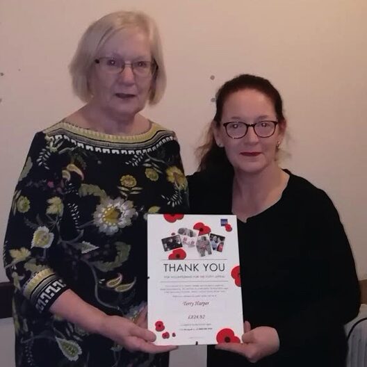 Terry Harper receives certificate from Sarah Ferris, Poppy Charity's Community Fundraiser for donation to last year's Charitly Tea Dance for the Poppy Appeal.